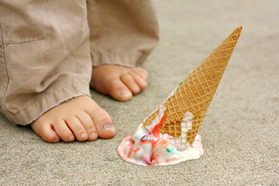 child with spilled ice cream